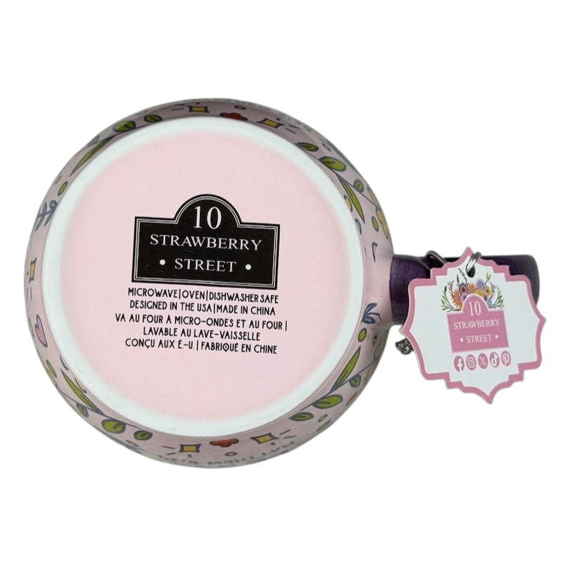 Bottom view of the pray more worry less 10 Strawberry Street mug with colorful design and care instructions