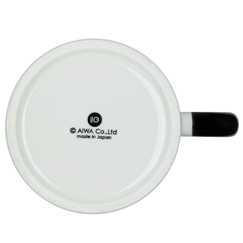 Bottom view of the Raccoon Mug Aiwa showing the brand logo and sleek design details
