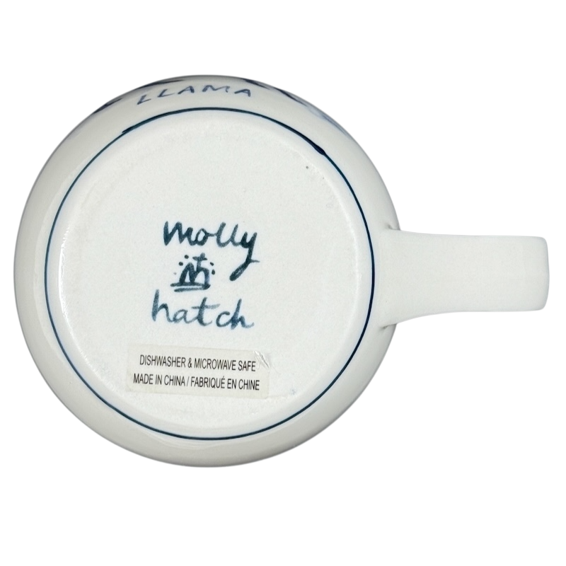 Bottom view of Anthropologie Molly Hatch llama collectible mug showcasing signature and care instructions