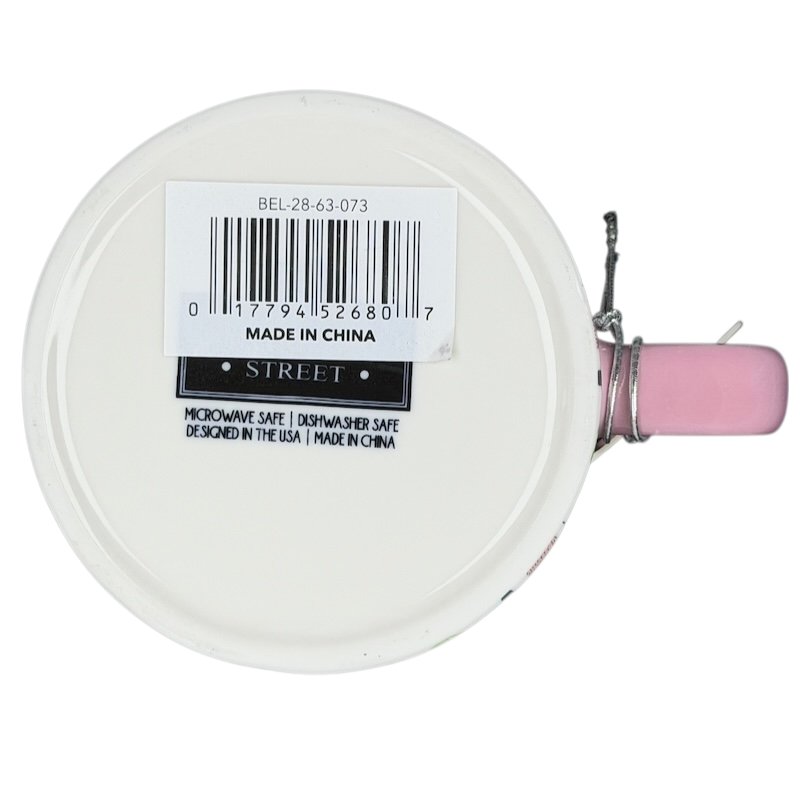 Bottom view of Bella dimpled wildflower mug with pink handle showing dishwasher safe tag
