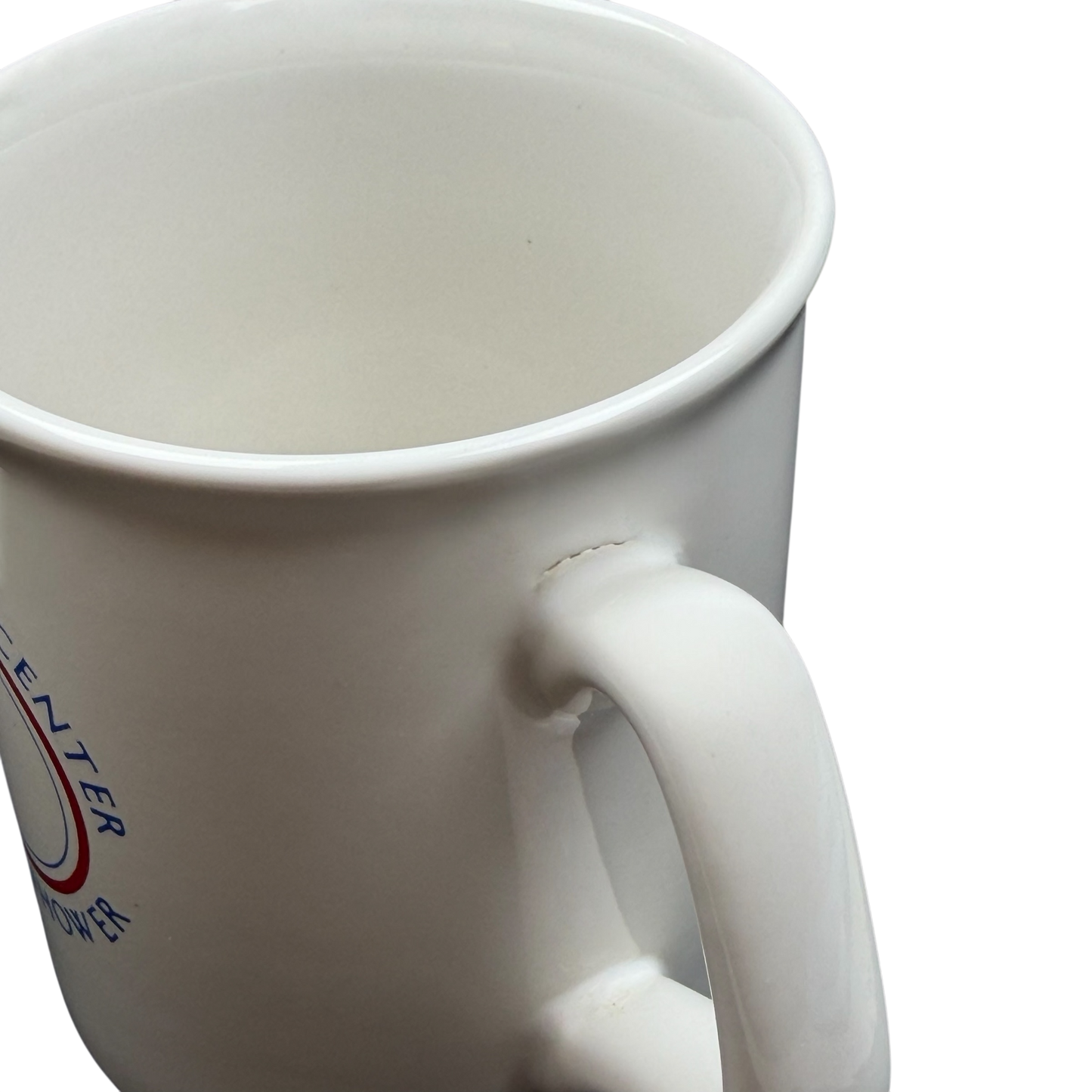 White ceramic Betty Ford Center At Eisenhower mug with a round handle for beverages
