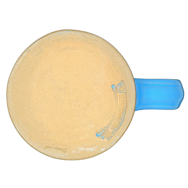 Top view of a Mount Rainier National Park Mug Deneen Pottery with a blue handle and unglazed interior