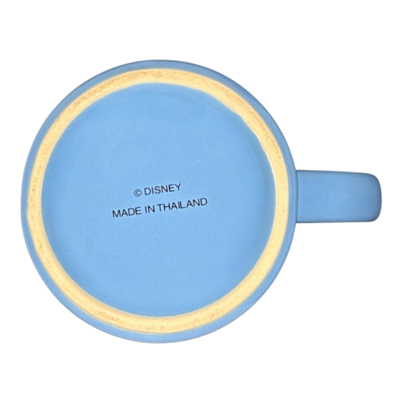 Blue ceramic mug bottom with Disney stamp and handle visible vintage Mickey Mouse starring tonight curtain call mug