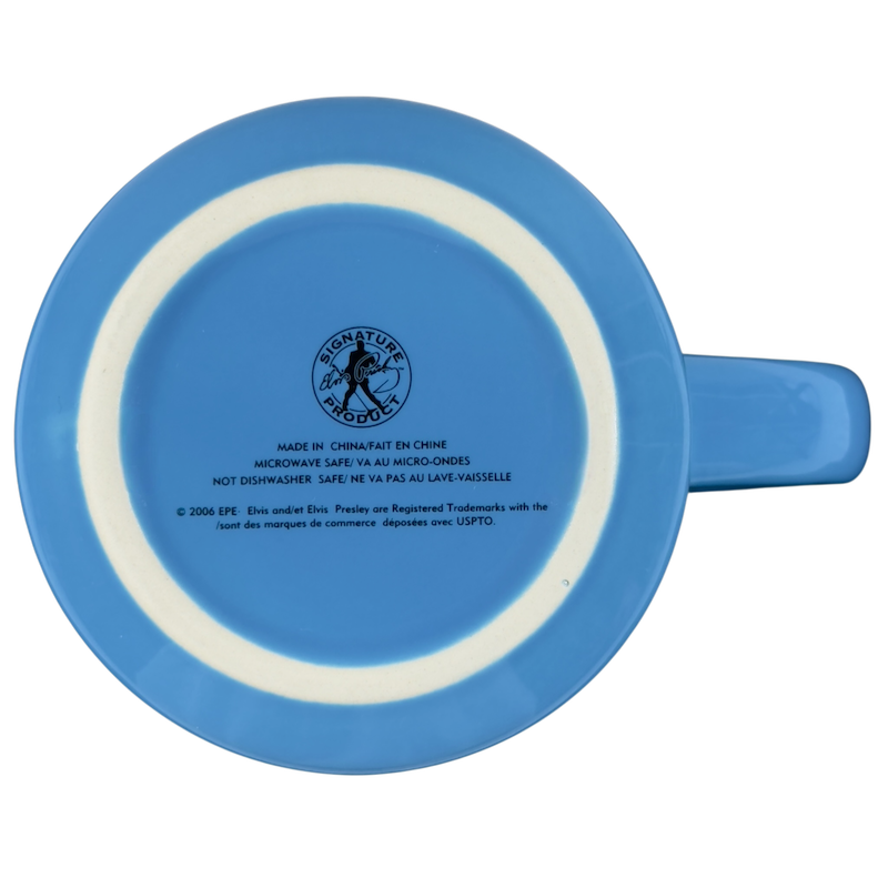 Back view of an Elvis Presley collectible mug featuring a blue design and signature logo