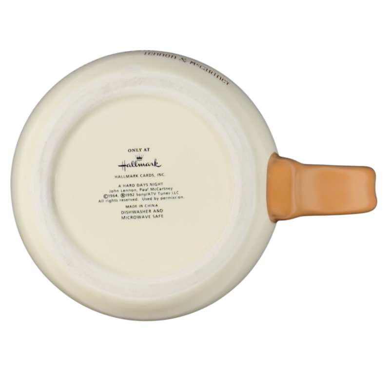 Bottom view of Hallmark Lennon McCartney vintage mug showcasing the branding and care instructions