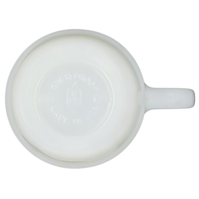 Bottom view of a Disney Mickey Mouse Fantasia Pepsi milk glass mug showcasing its smooth finish