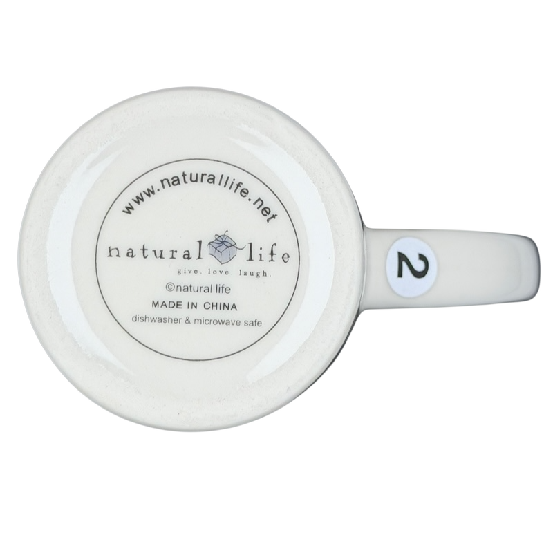 Bottom view of Natural Life Dance as if no one were watching mug with label details