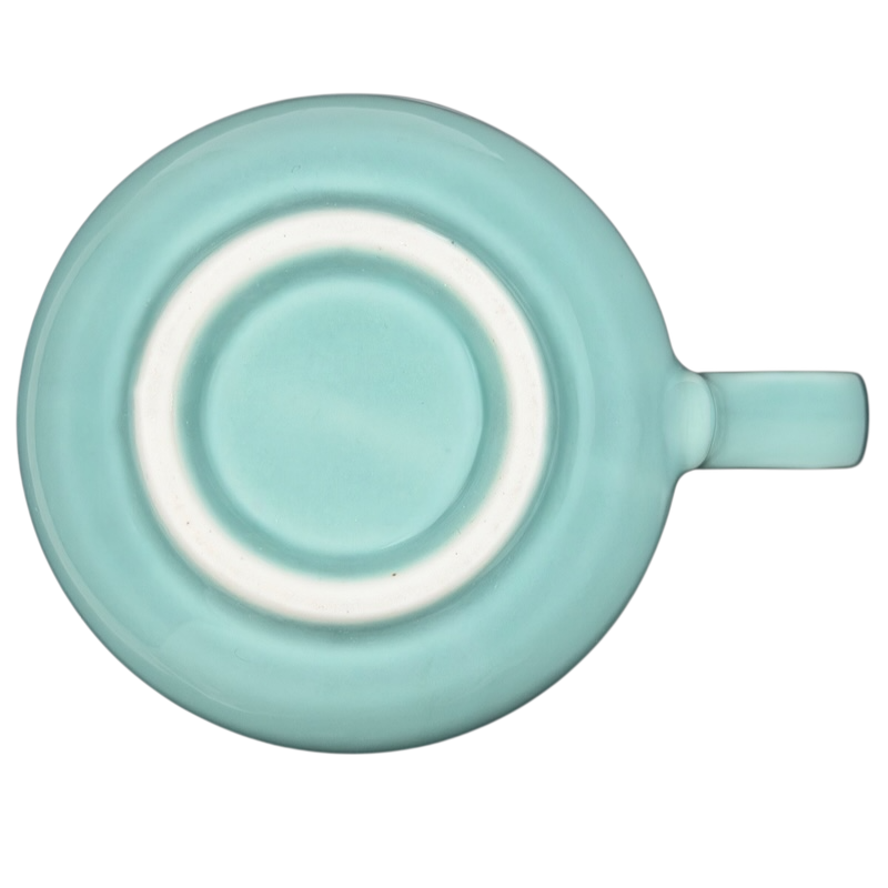 Bottom view of an Otagiri calico cat vintage tankard mug showcasing the smooth turquoise finish