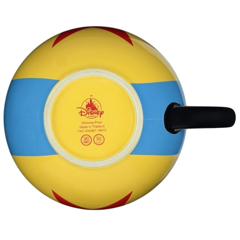 Bottom view of Pixar Luxo Ball collectible Disney mug with yellow and blue design and Disney branding