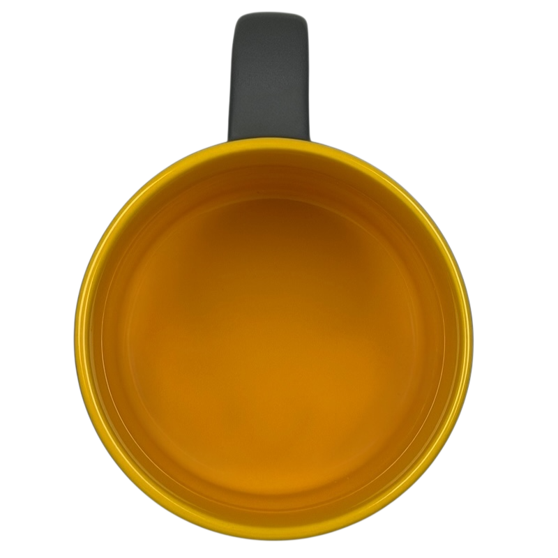 Top view of a rare Redmond Nintendo mug in vibrant yellow color with a comfortable handle