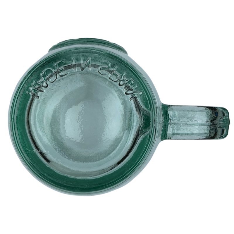 Top view of Starbucks San Miguel recycled green glass mug with a clear handle and textured surface