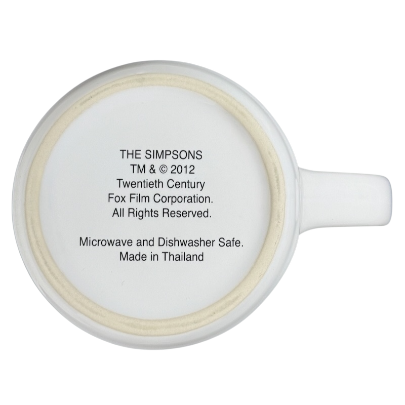 The Simpsons Homer Universal Studios donut mug with official copyright and microwave safe information on the bottom