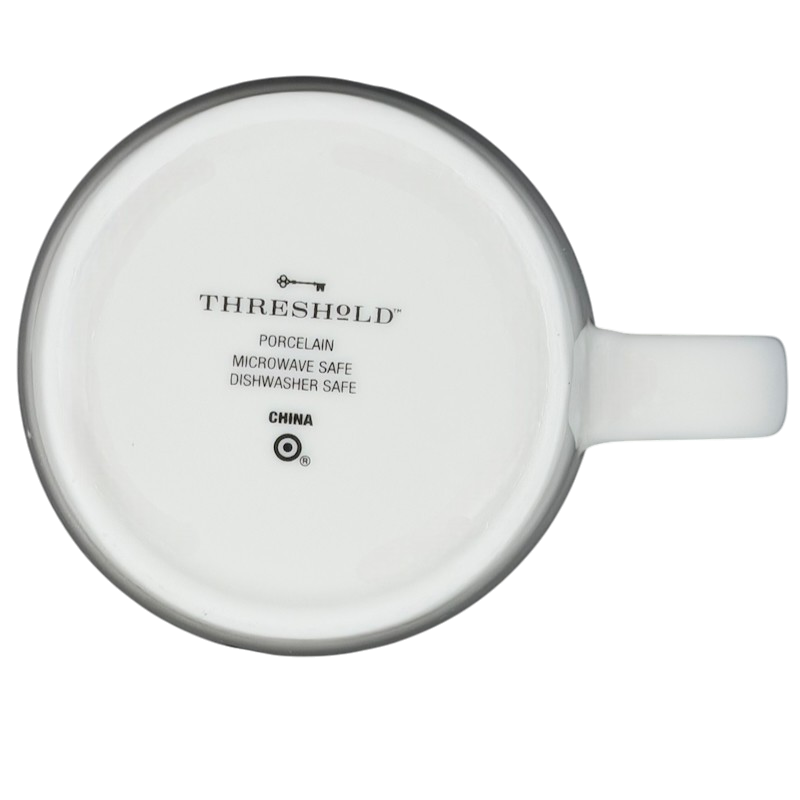 Bottom view of Threshold AQUARIUS Astrology Zodiac Mug featuring a porcelain construction and care instructions