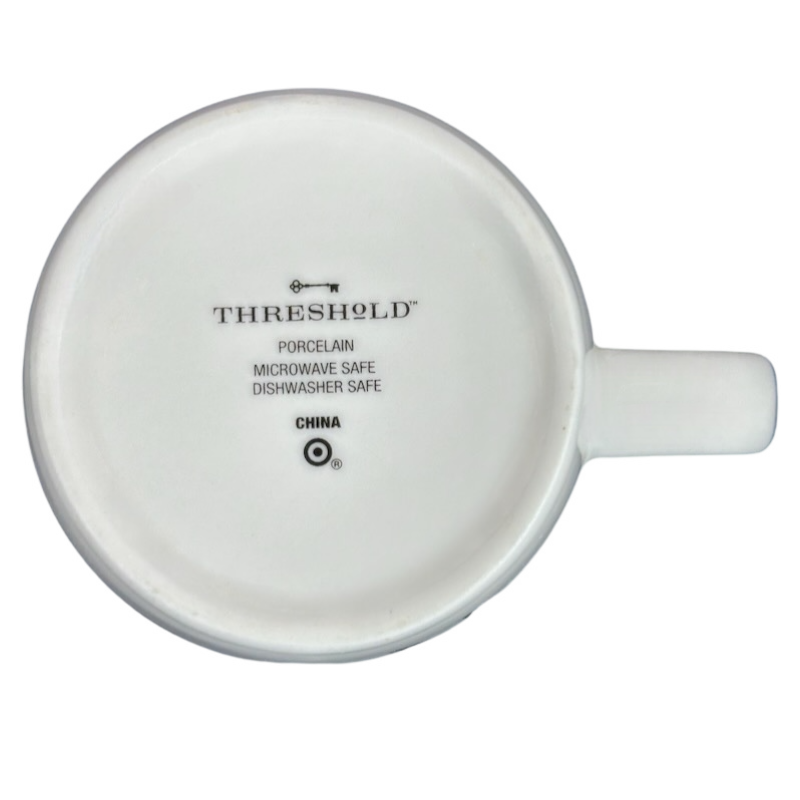 Bottom view of Threshold Aries Astrology Zodiac Mug showcasing porcelain and care instructions