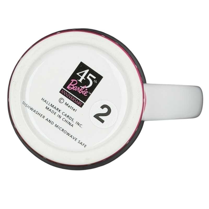 Bottom view of vintage Barbie 45th accessories mug with Hallmark branding and care instructions