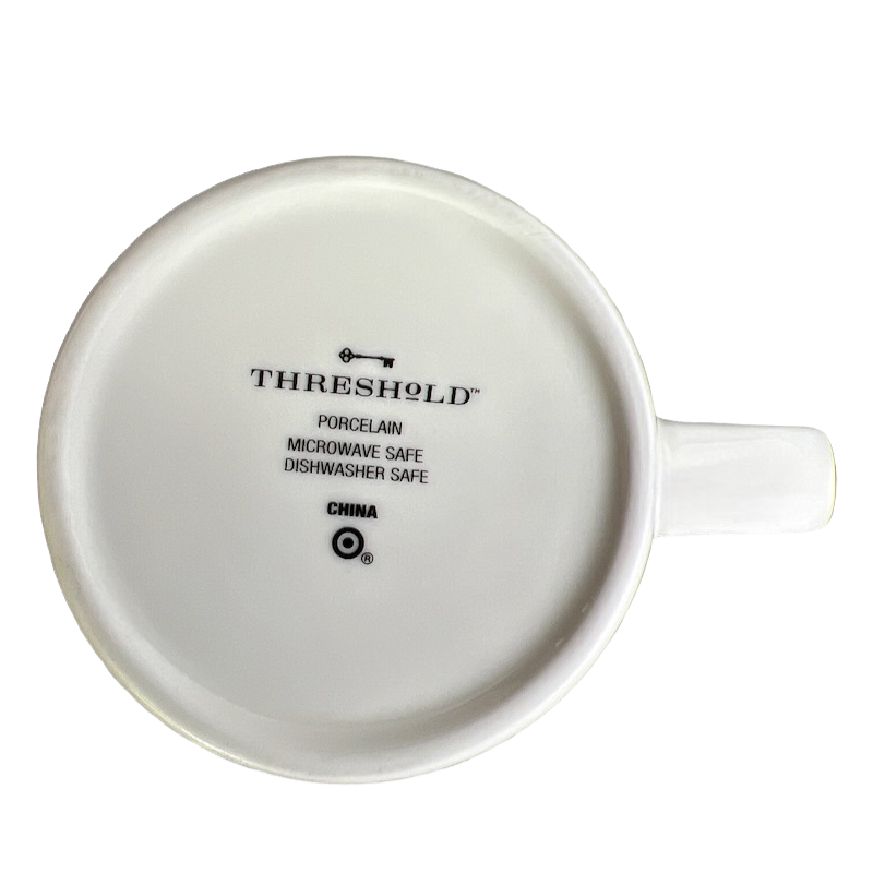 Bottom view of white Threshold Pisces astrology mug showing Threshold logo and microwave dishwasher safe marks