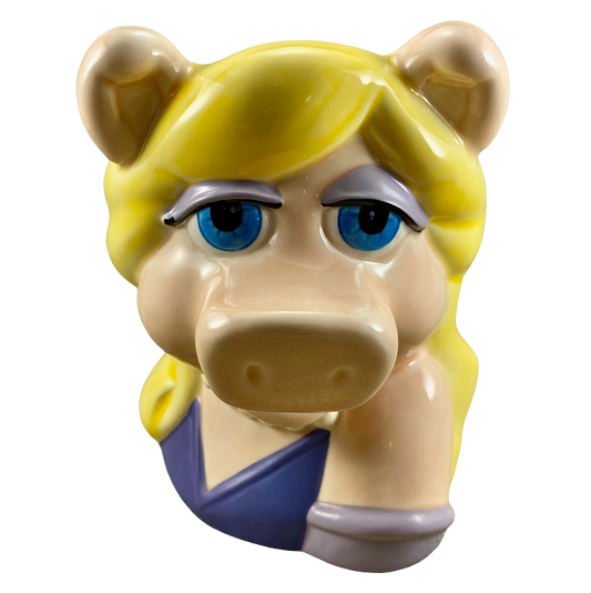 Vintage collectible mugs featuring Miss Piggy with blonde hair and blue eyes