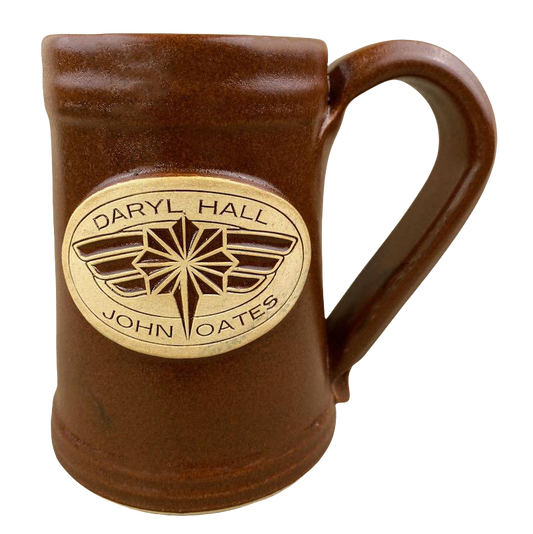Brown vintage collectible mug featuring Daryl Hall and John Oates logo design