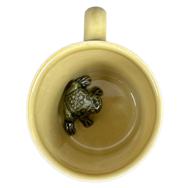 Vintage collectible surprise mugs featuring a charming frog at the bottom of the cup