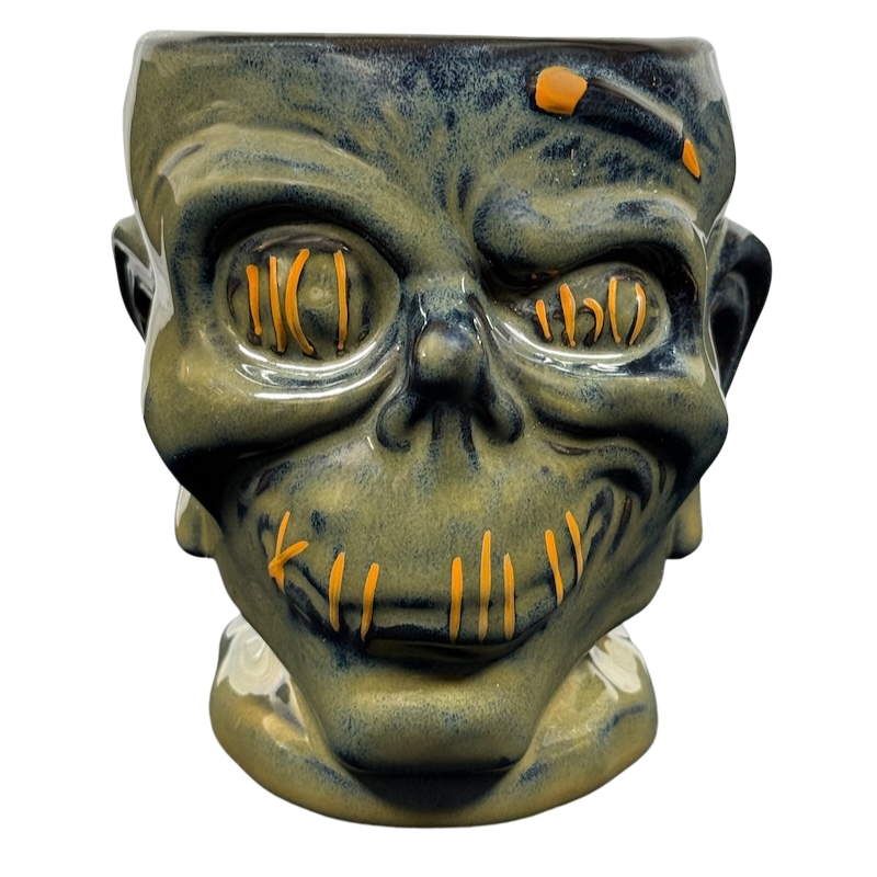 Tiki-themed mug collection featuring unique designs and vibrant colors for tropical drinks