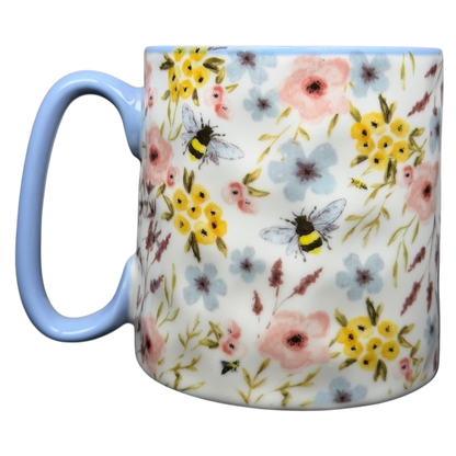 10 Strawberry Street bumblebee wildflowers mug featuring colorful floral designs and a blue handle