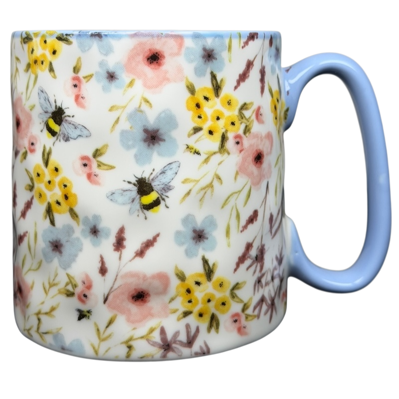 10 Strawberry Street bumblebee wildflowers mug featuring a floral design with bees and pastel colors