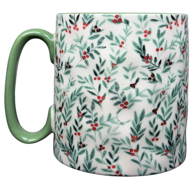 10 Strawberry Street Christmas mug featuring a festive foliage design with green handle