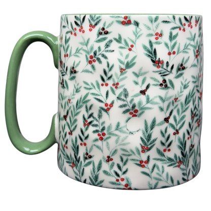 10 Strawberry Street Christmas mug featuring a festive foliage design with green handle