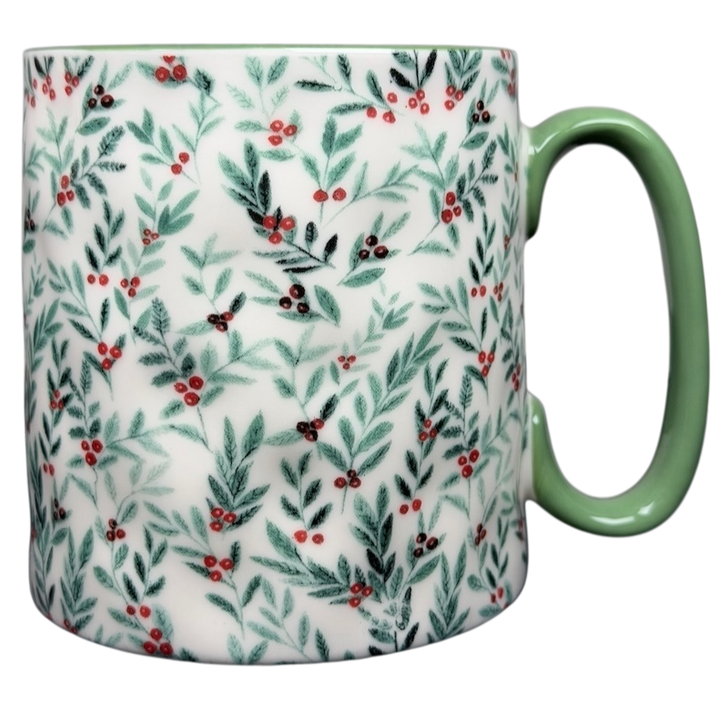 10 Strawberry Street Christmas mug with green handle and festive holly leaf design