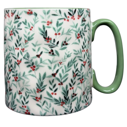 10 Strawberry Street Christmas mug with green handle and festive holly leaf design