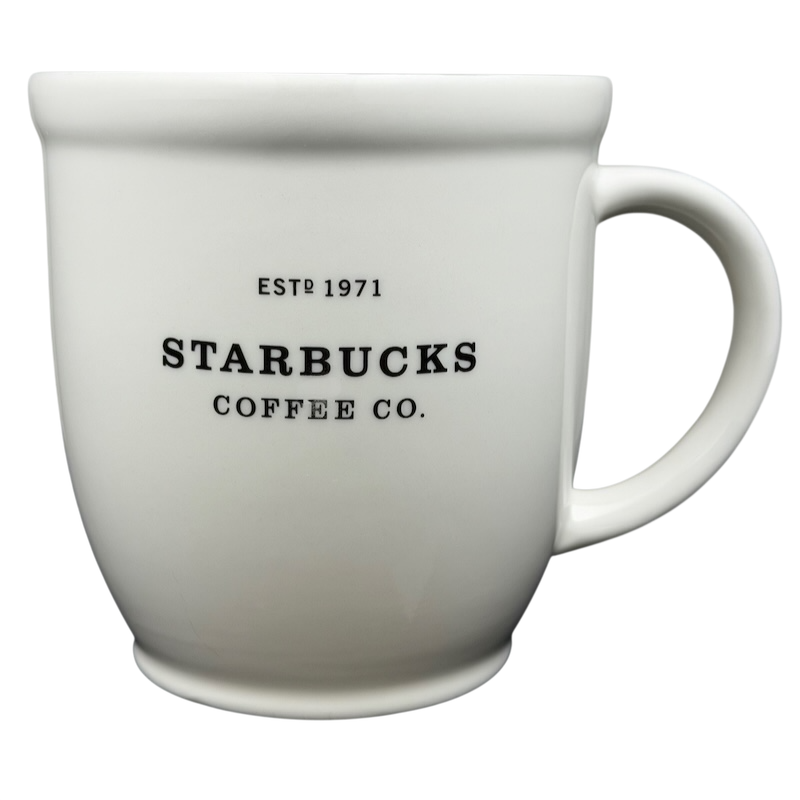 2007 Starbucks Abbey ESTD 1971 mug in white ceramic with black lettering.