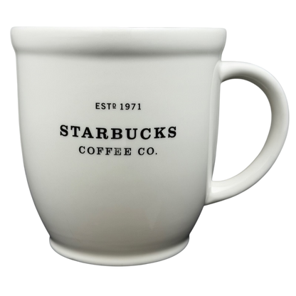 2007 Starbucks Abbey ESTD 1971 mug in white ceramic with black lettering.
