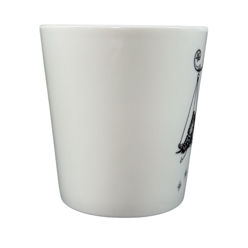 White ceramic Rory Dobner astrology mug with black celestial design on side from Williams-Sonoma