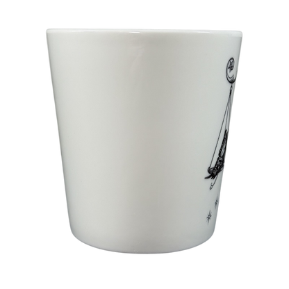 White ceramic Rory Dobner astrology mug with black celestial design on side from Williams-Sonoma