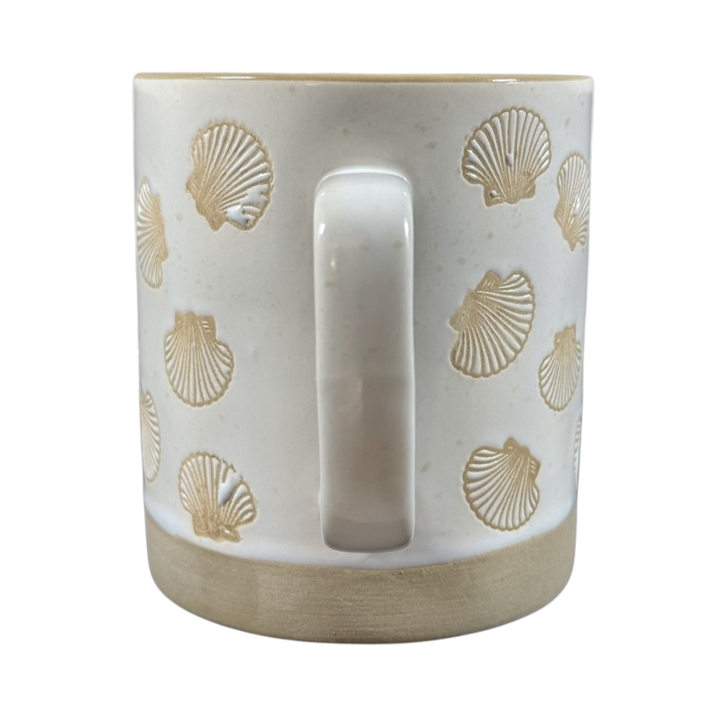 White ceramic sea shell under the sea coffee mug with embossed seashell designs and a smooth handle