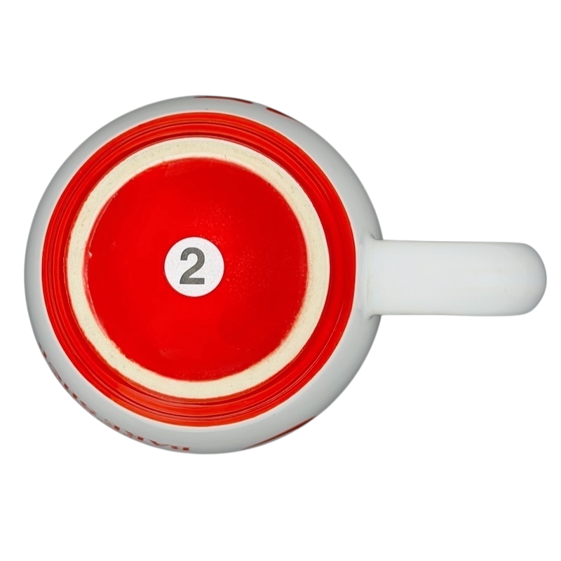 Top view of M Ware Carlo's Bake Shop collectible mug with red and white design