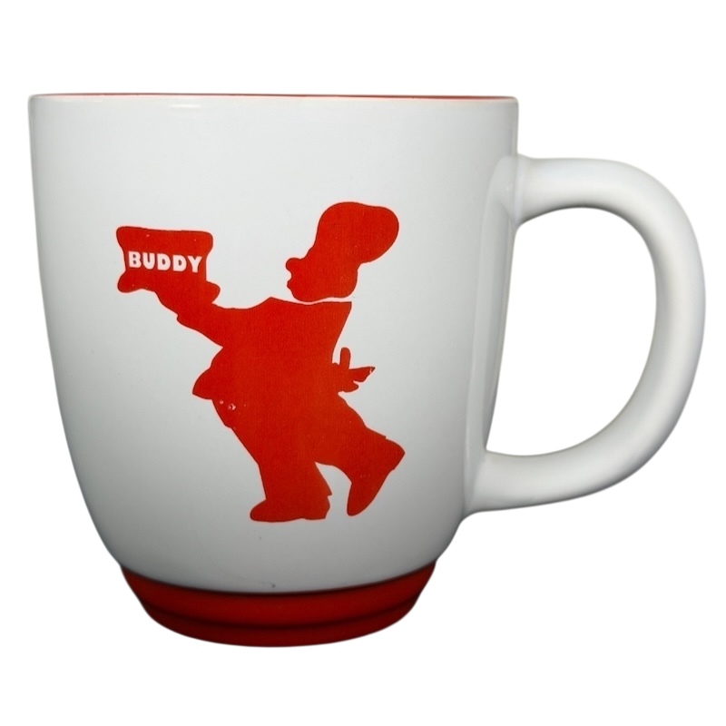 Carlo's Bake Shop collectible mug featuring a red silhouette of Buddy holding a cake