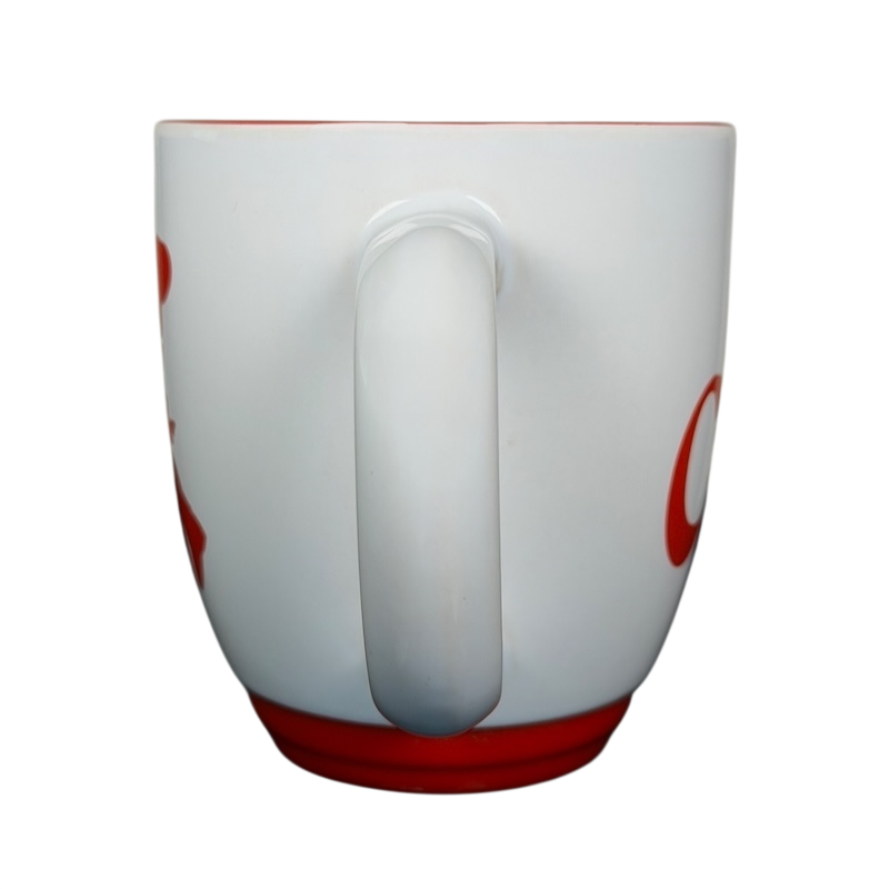 Carlo's Bake Shop collectible mug with a red bottom and handle in a simple white design