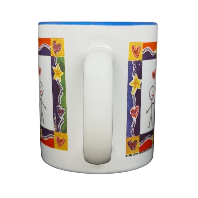 A Hundred Years From Now mug featuring colorful stick figure designs and heart decorations