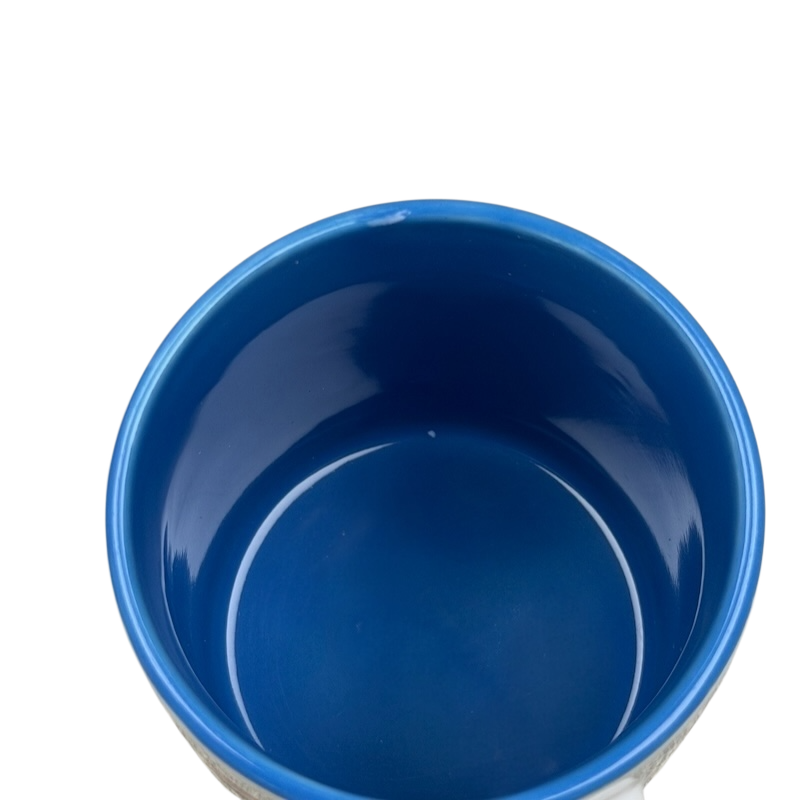 Inside view of A Hundred Years From Now mug featuring blue interior and smooth finish