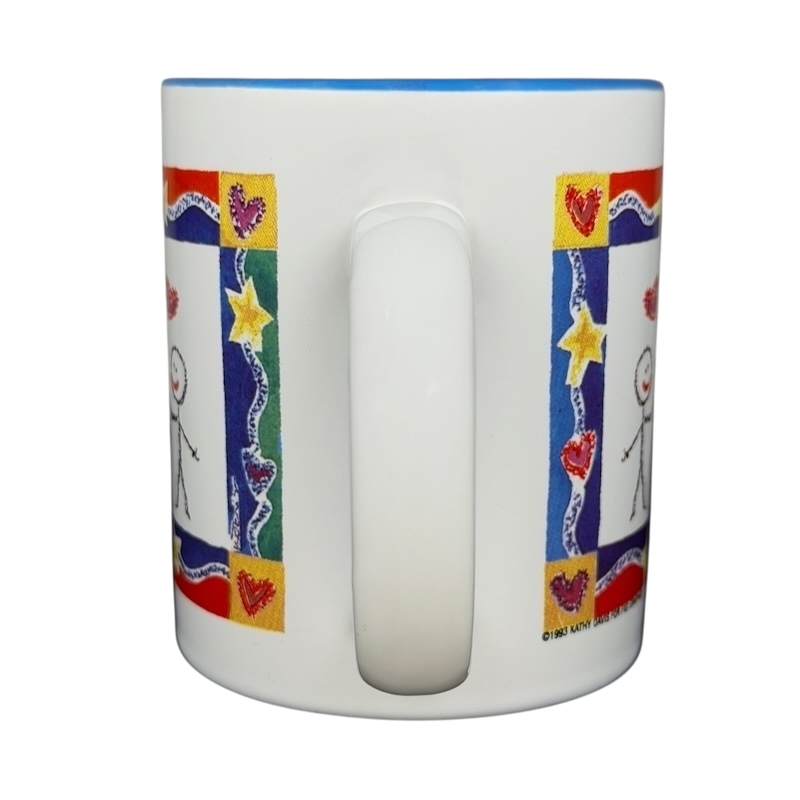 A Hundred Years From Now mug featuring colorful stick figure art and heart designs for a unique gift