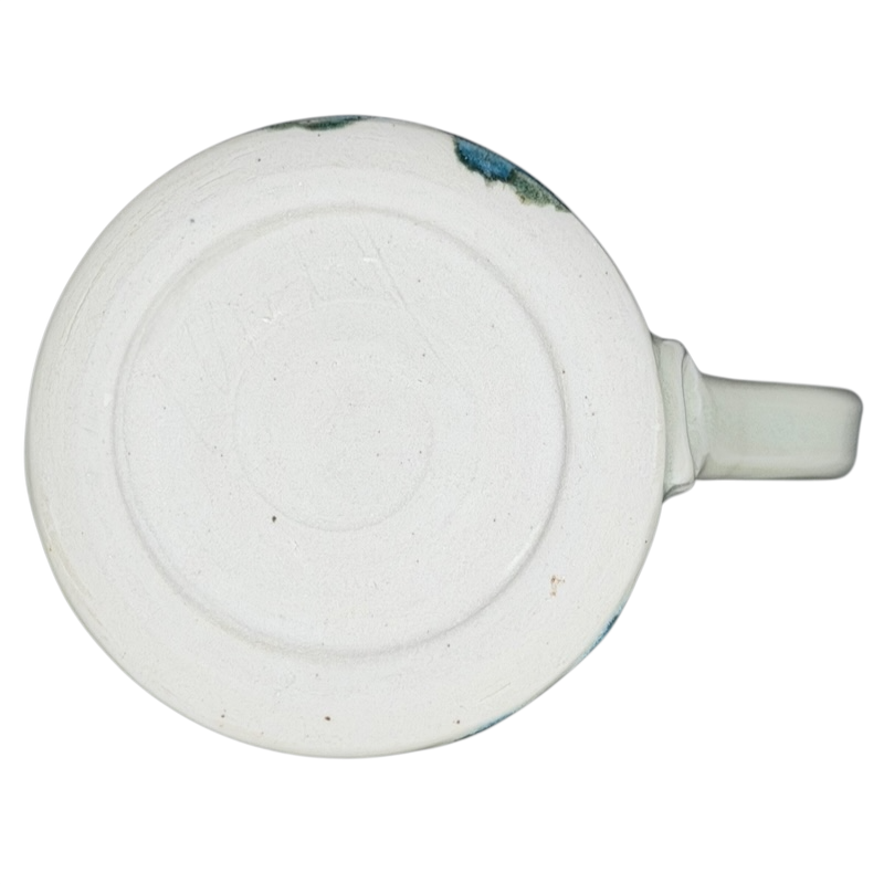 Bottom view of an Abstract Pastel Landscape Signed Pottery Mug showcasing its smooth finish