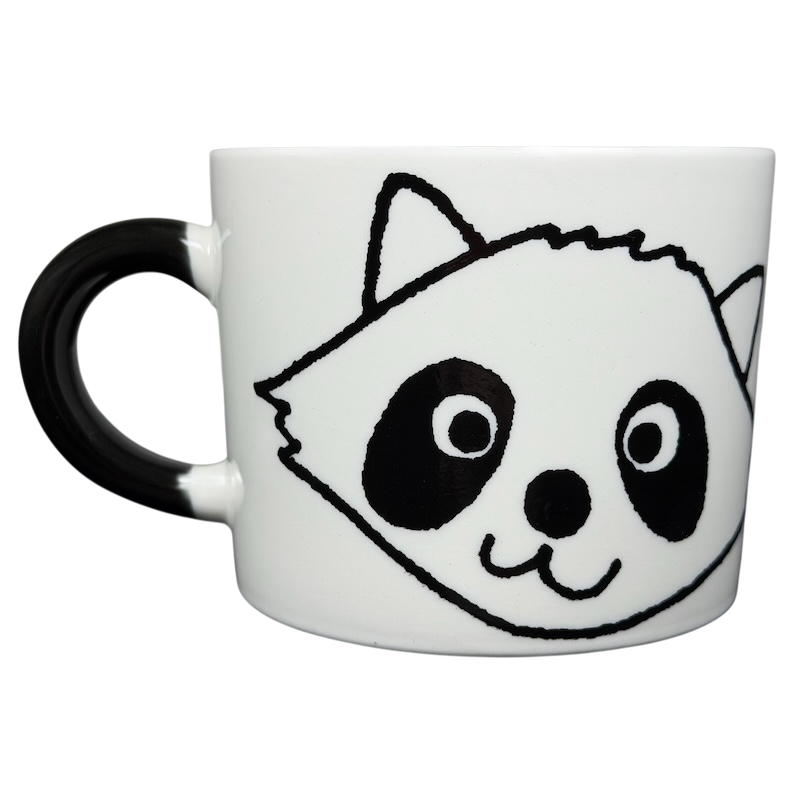 Adorable Raccoon Mug Aiwa with a playful raccoon face design and black handle