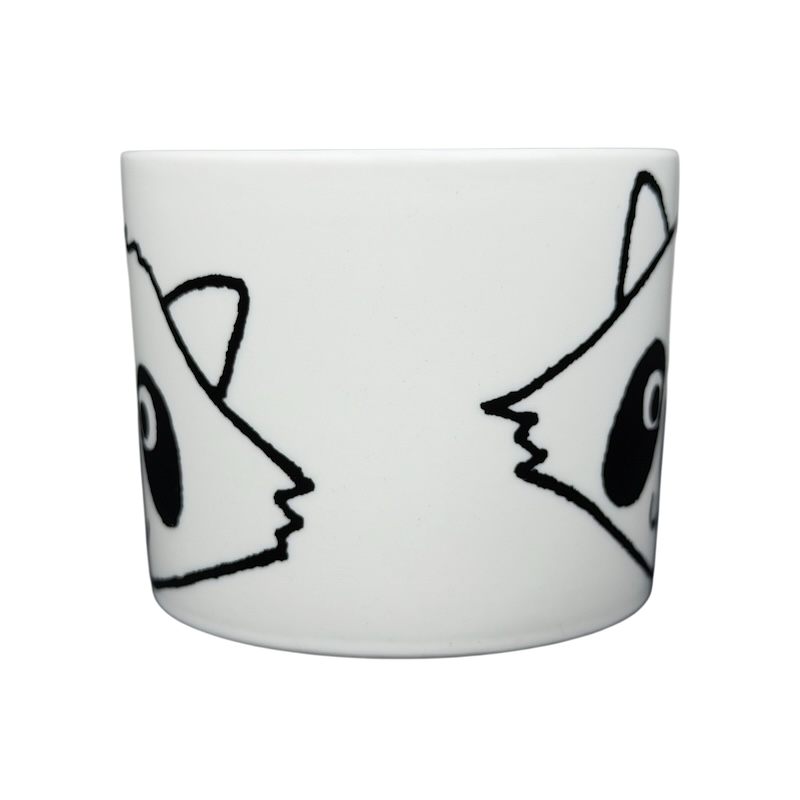 White ceramic Raccoon Mug Aiwa featuring playful raccoon face designs on both sides