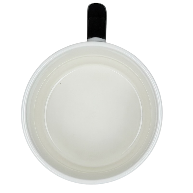 Top view of a white Raccoon Mug Aiwa with a black handle, perfect for coffee lovers