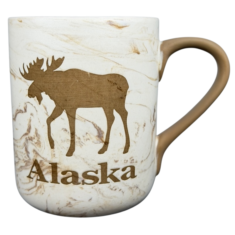 Alaska Marbled Moose Mug with a silhouette of a moose and the word Alaska printed on a marbled design