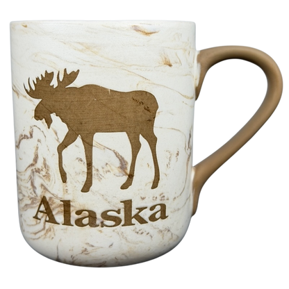 Alaska Marbled Moose Mug with a silhouette of a moose and the word Alaska printed on a marbled design
