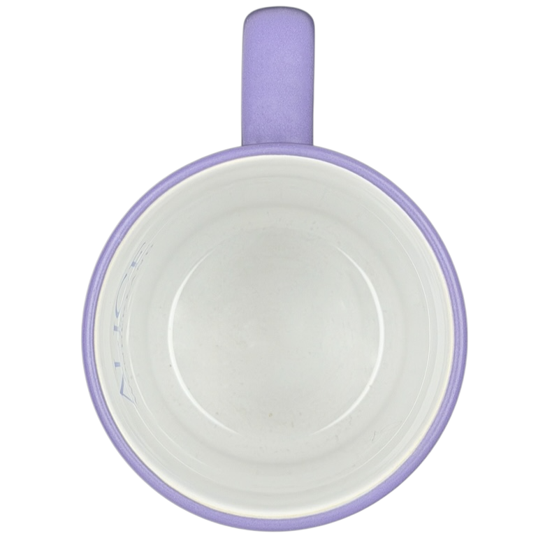 Inside view of a purple Alice in Wonderland Collage Mug Disney Store with a smooth finish