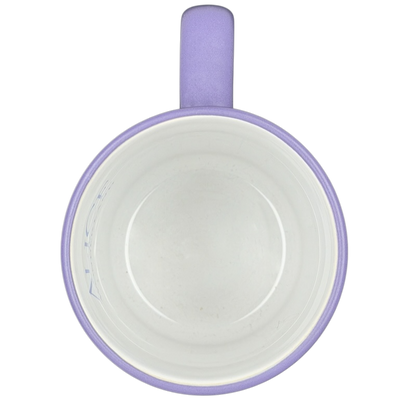 Inside view of a purple Alice in Wonderland Collage Mug Disney Store with a smooth finish