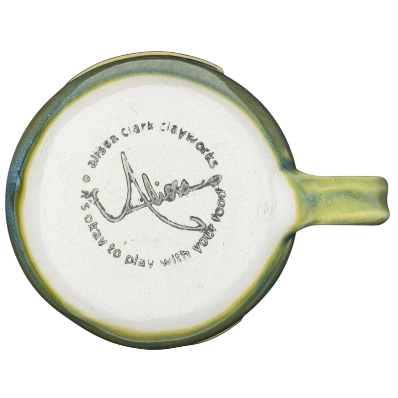 Bottom view of Alissa Clark Clayworks heart mug showcasing unique signature and design details